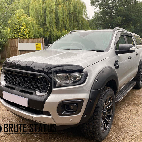 Ford Ranger 2019-2022 Black Grille with White LEDs, designed for Wildtrak models, showcased on a parked silver truck.