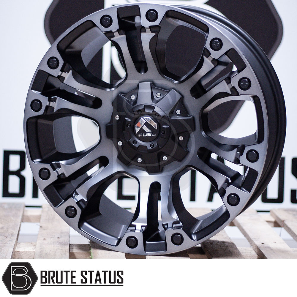 Fuel Vapor Wheels in matte black, displayed on a wooden pallet, highlighting the alloy design and automotive application, suitable for pick-up truck customization.