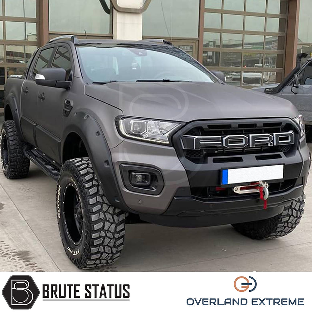 Ford Ranger 2012-2022 Matte Black Wide Arch Kit with riveted style, shown on a parked truck, highlights robust wheel arches and precise fitment for double cab models.