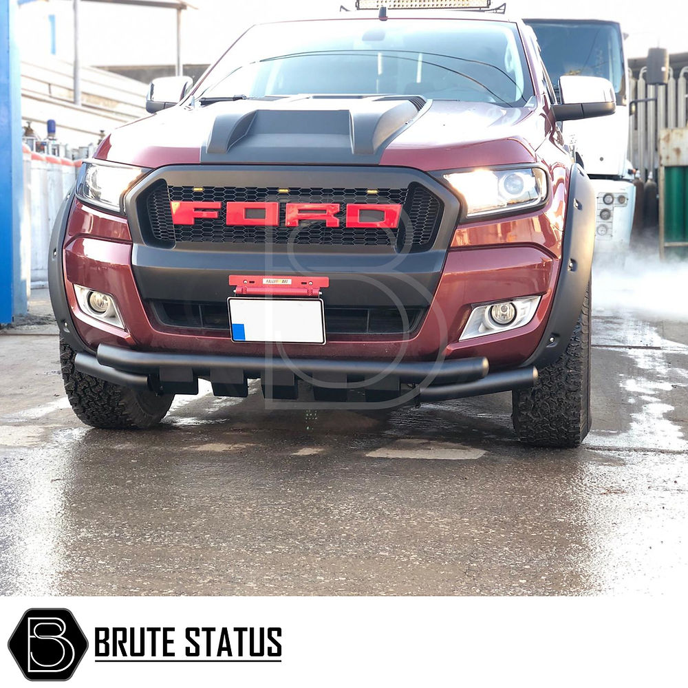 Ford Ranger 2015-2022 City Bar (Nudge Bar) Matte Black, enhancing bumper protection with sleek design, visible on a wet road.