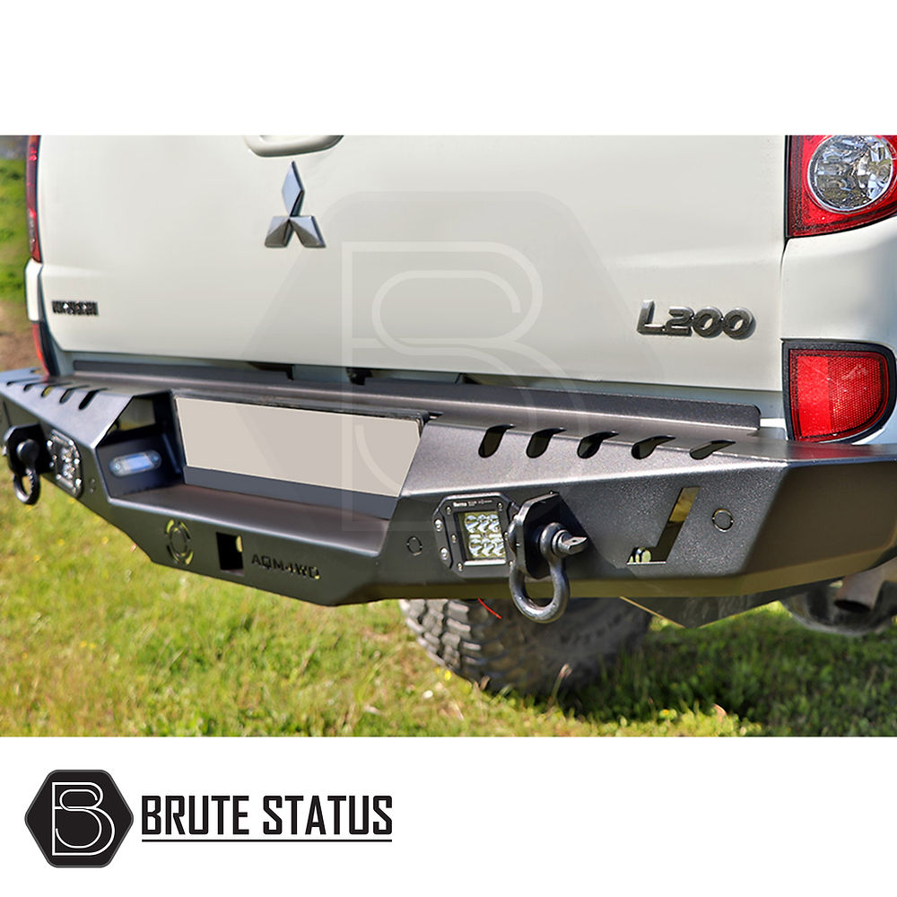 Isuzu D-Max 2021+ Rear Bumper Matt Black shown on a truck, highlighting its stylish design and integration with tail lights and parking sensor cutouts.