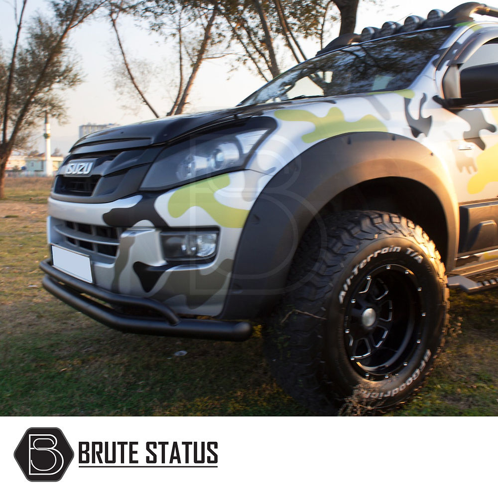 Isuzu D-Max 2012-2021 City Bar/Nudge Bar in matt black, showcasing premium Overland Extreme wheel arches and durable ABS plastic, parked on grass.