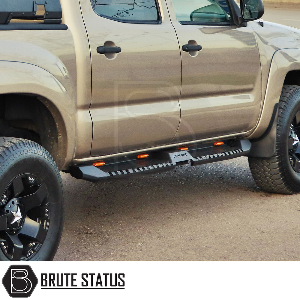 Toyota Hilux 2015+ Heavy Duty S32 Steel Side Steps with LEDs, showcasing a close-up of truck tire and sleek matt black finish.