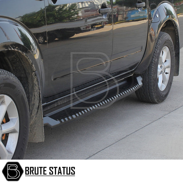 Toyota Hilux 2006-2014 Heavy Duty S30 Steel Side Steps in matt black, close-up of tire and side step, emphasizing durability and precision fit.