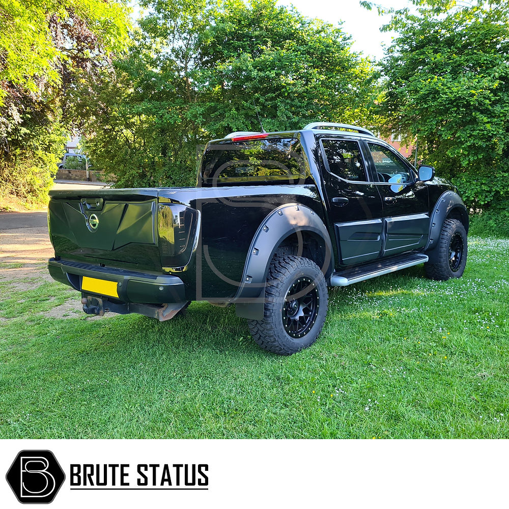 Nissan Navara NP300 2015-2022 LED Tail Lights on a black truck, showcasing aftermarket design for enhanced nighttime visibility and unique styling.