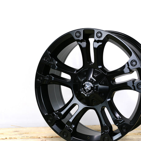 Wolfrace Brooklyn Wheels, Matt Black, featuring a sleek black rim with a distinctive black and silver logo, designed for pick-up truck customization.