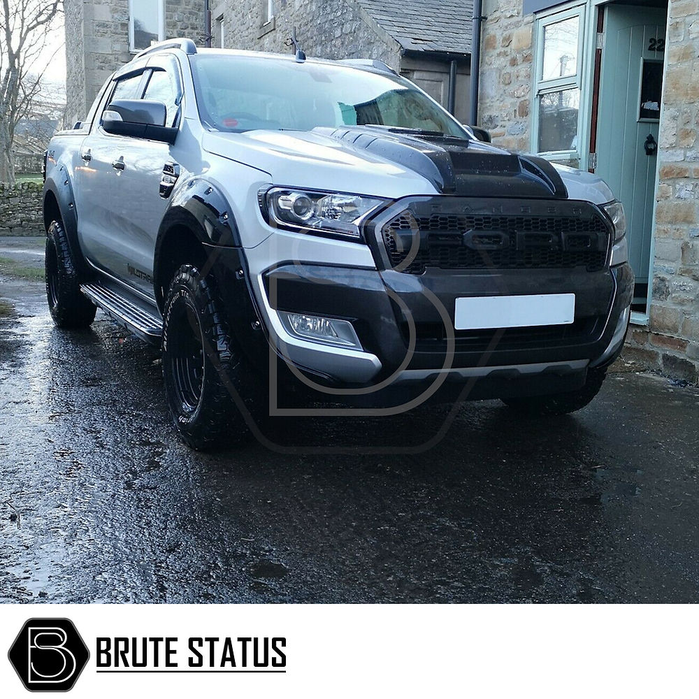 Ford Ranger 2015-2022 T7 T8 Head Light Covers Matte Black, shown on a parked SUV, enhancing the vehicle's aggressive front design with easy-to-install high-quality ABS plastic.