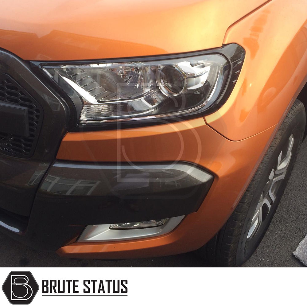 Ford Ranger 2015-2022 T7 T8 Head Light Covers Gloss Black, enhancing the vehicle's front with an aggressive look; shown close-up with headlight detail.