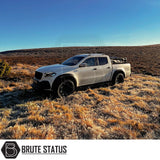 Mercedes X-Class Slimline Wheel Arch Kit on a white truck in a grassy field, showcasing stylish, durable arches for enhanced vehicle appearance and functionality.