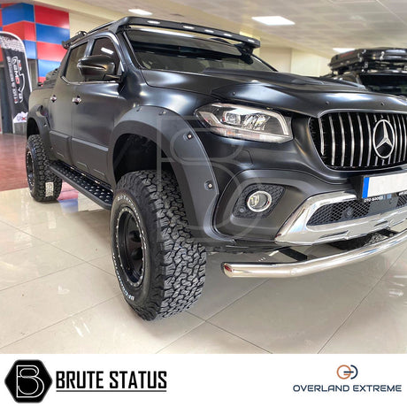 Mercedes X-Class 2017-2020 Wide Arch Kit (Overland Extreme) displayed on a black truck in showroom, highlighting premium wheel arches for enhanced vehicle style.