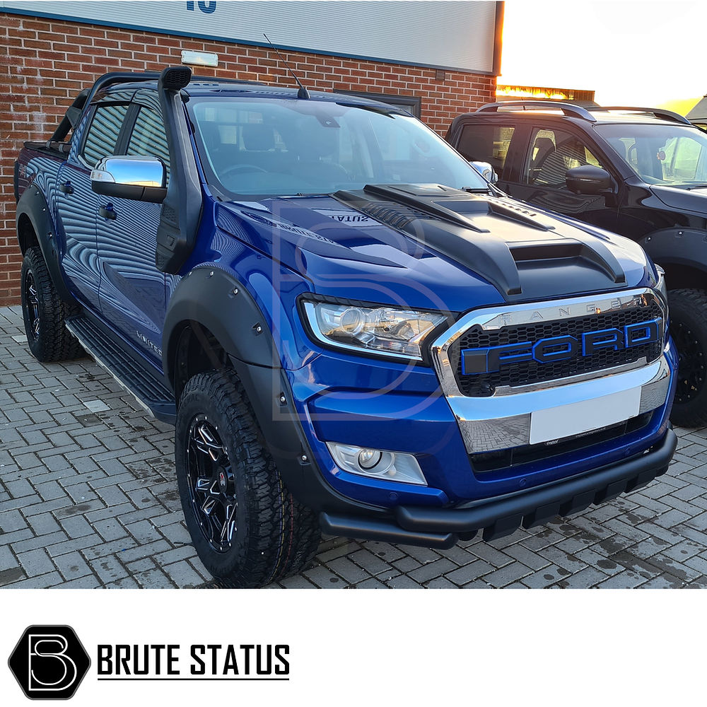 Ford Ranger 2016-19 Wide Arch Kit (Riveted Style) installed on a blue truck, showcasing durable, stylish arches enhancing the vehicle's rugged appearance.