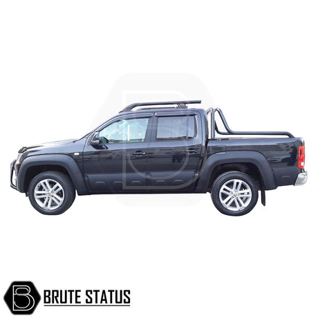 VW Amarok 2010-2022 Window Deflector Sun Shade attached to a black truck, featuring durable, aerodynamic design and full-length adhesive for secure installation.