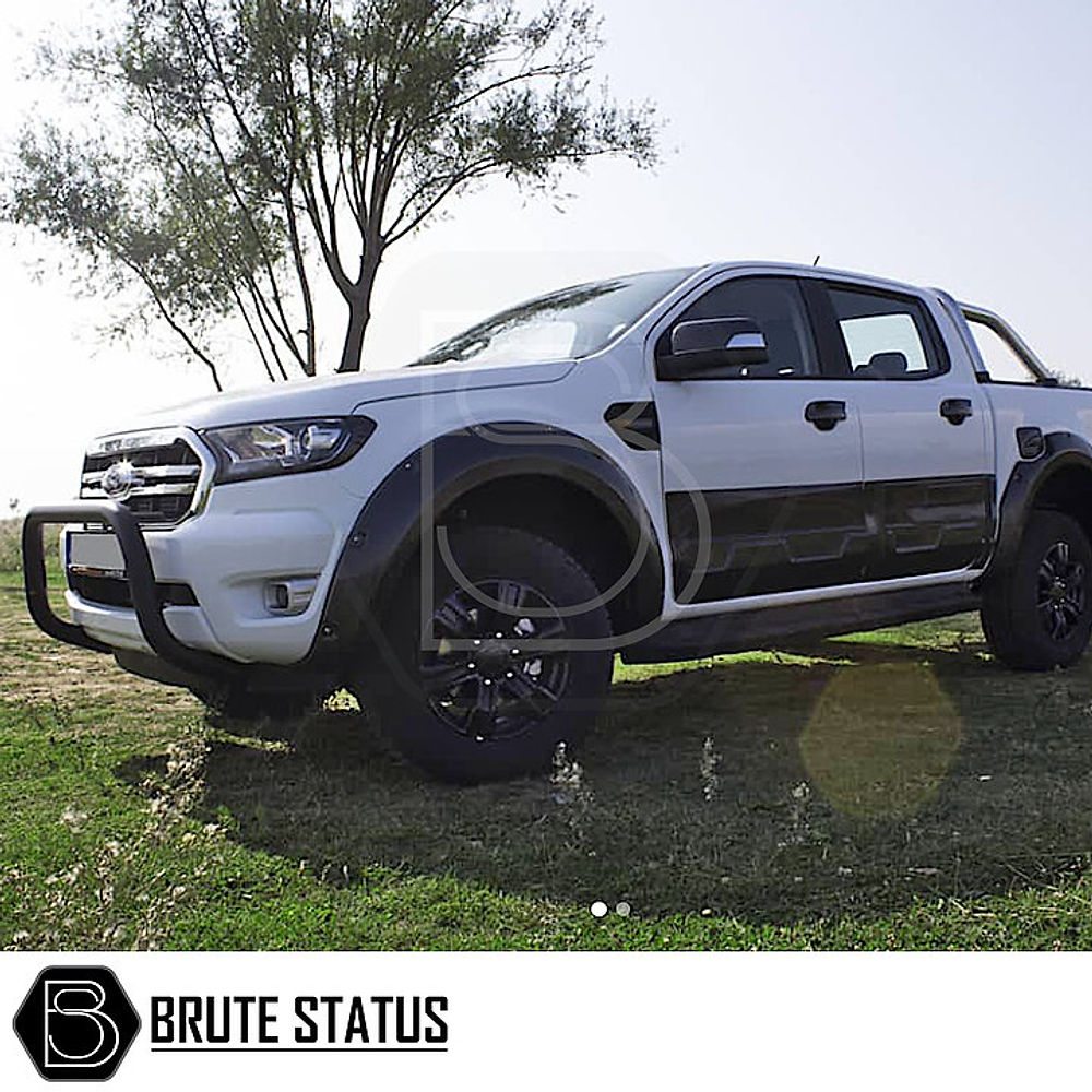 Nissan Navara D40 2006-2015 Bull Bar (Nudge Bar) Matt Black showcased on a white truck, highlighting its sleek design and protective features.