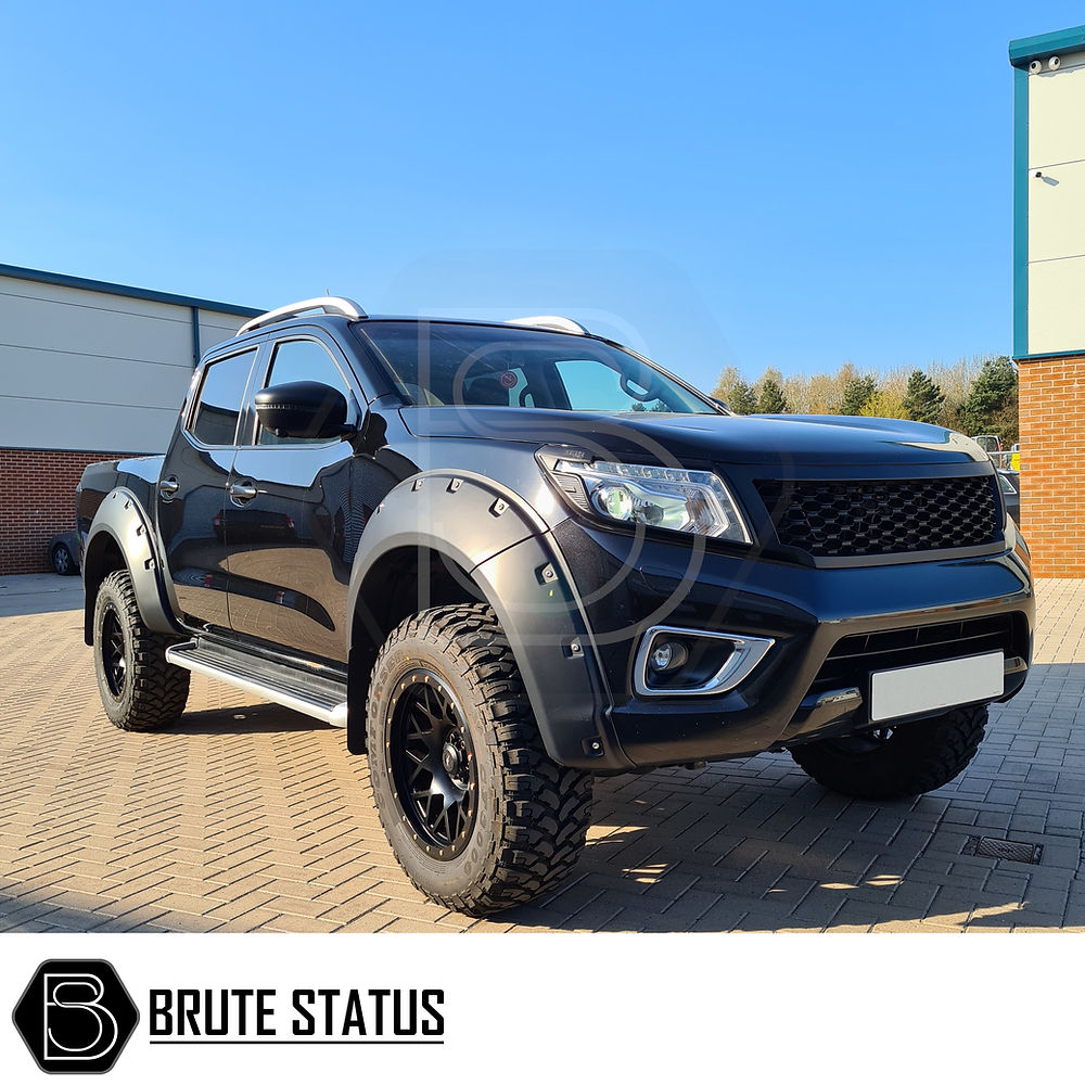 Nissan Navara NP300 2015-2022 Door Handle Covers in matt black, showcased on a parked truck, emphasizing easy installation and high-quality finish.