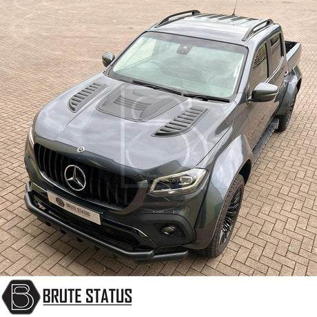 Mercedes X-Class Black Roof Rail Kit, displayed on a black truck, enhances customization with a high-quality finish for 2017+ models, shown on a brick surface.