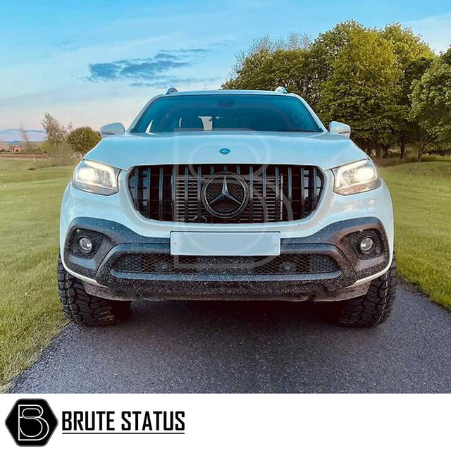 Mercedes X-Class AMG Panamerica Style Front Grille (All Black) installed on a white car, showcasing its sleek design and fitment, ideal for enhancing truck aesthetics.