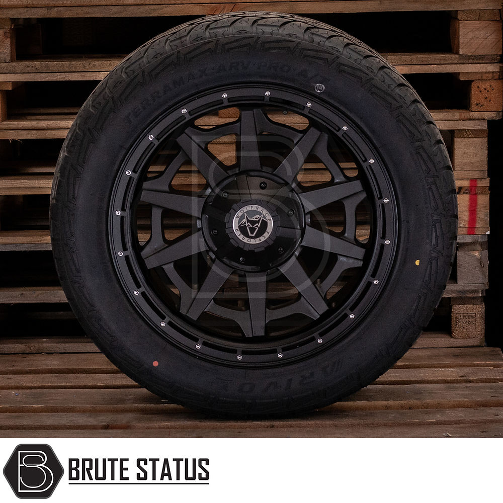 Wolfrace Canyon Matt Black Alloy Wheels and Tyres on wooden pallet, featuring TPMS and chrome rivets, designed for truck customization.