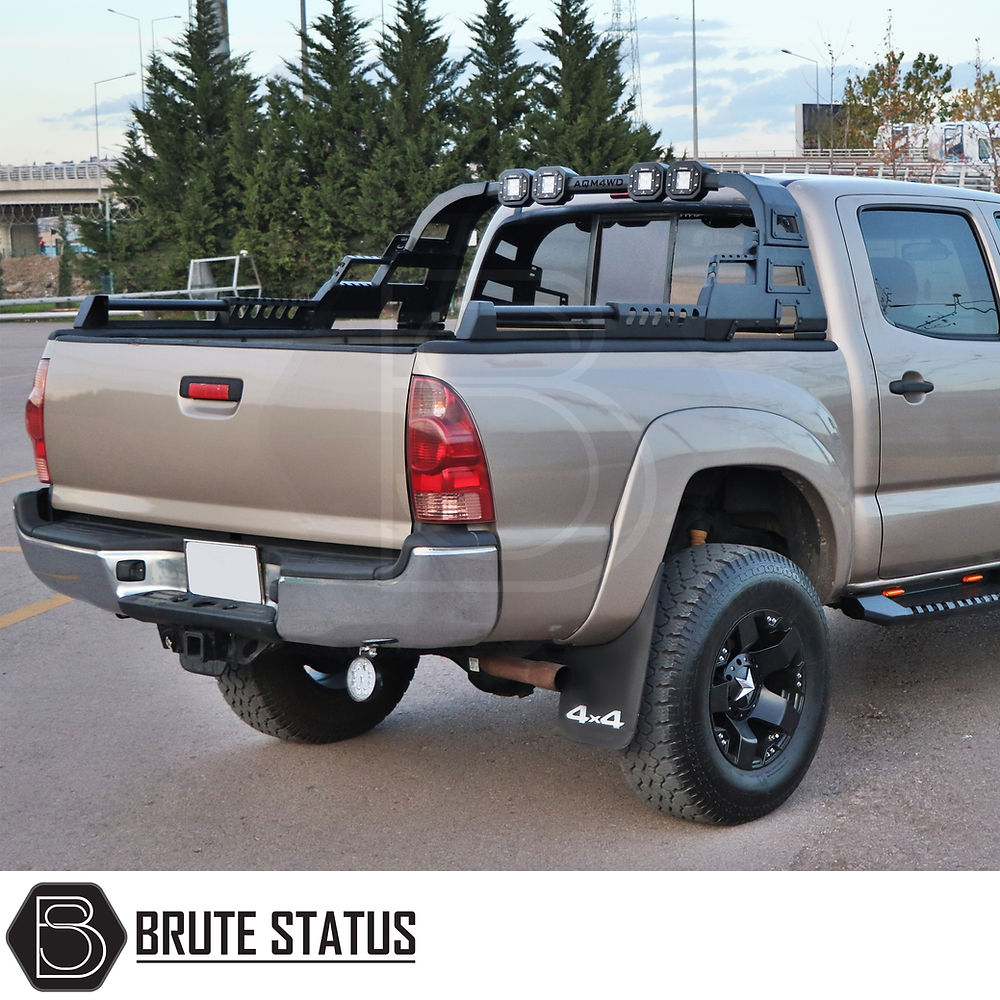 Ford Ranger 2023+ X10 Combat Roll Bar With LED Lights, parked truck view, showcasing heavy-duty steel construction and rack design, ideal for aggressive styling enhancements.