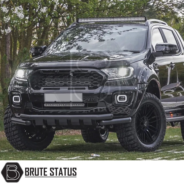 AXE Wheels AT8 in Gloss Black, shown on a black truck parked on grass, highlighting the wheel design and tread pattern.