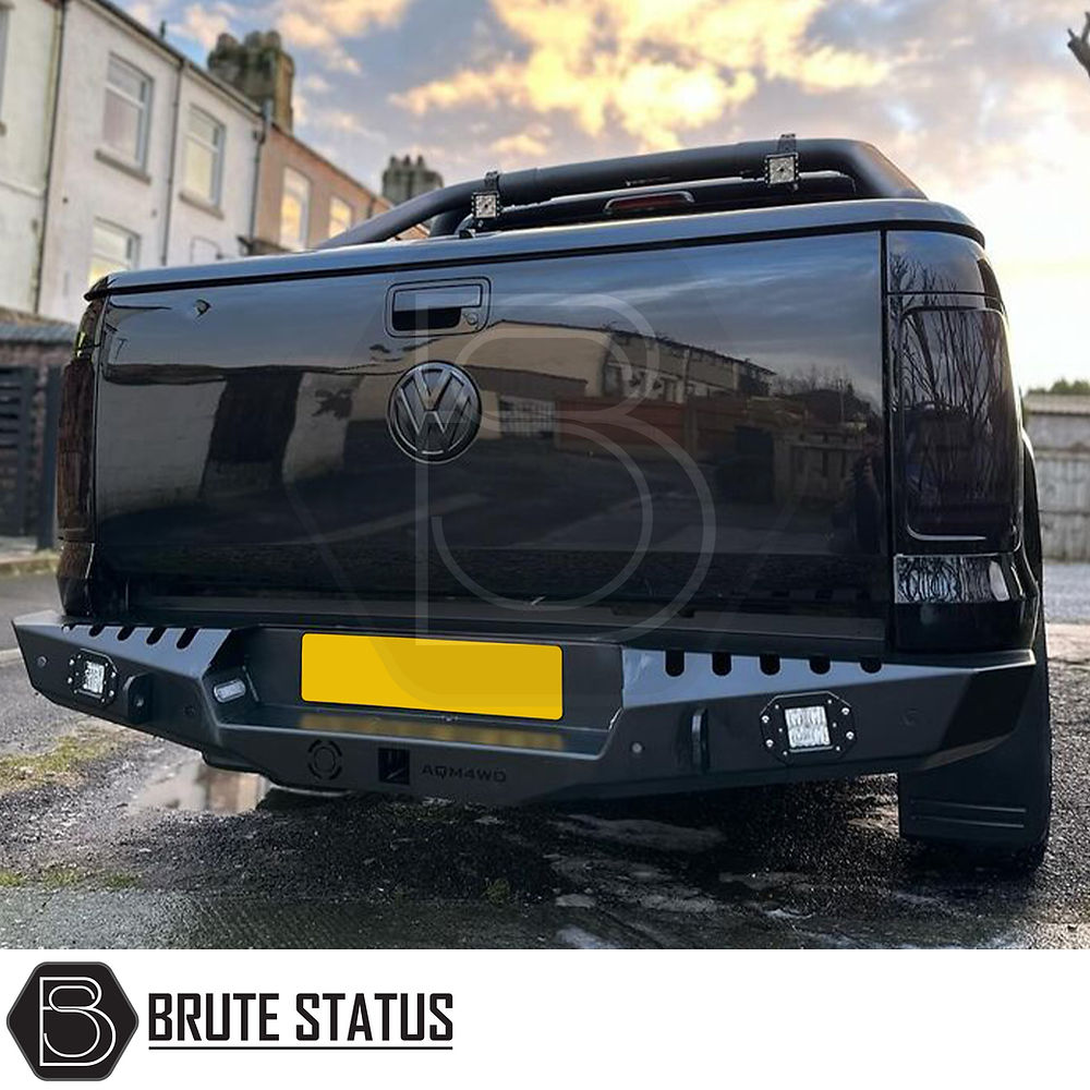 Volkswagen Amarok 2017-2022 Rear Bumper Matt Black, showcasing its stylish design and functionality, including parking sensor holes and lights, enhancing vehicle protection.