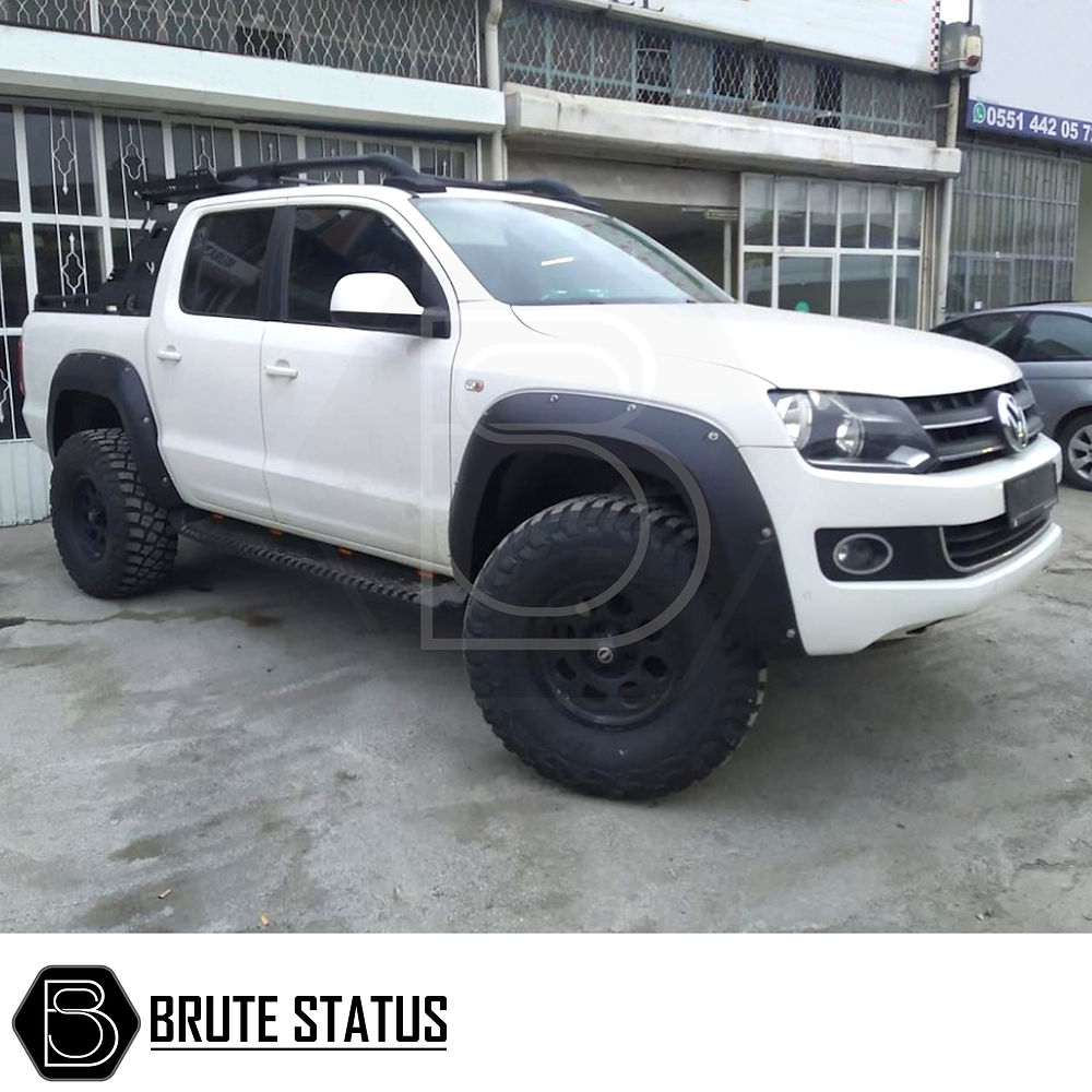 VW Amarok 2017-2022 Heavy Duty S30 Steel Side Steps with LEDs, shown installed on a white truck, featuring a robust matt black finish and secure mounting.