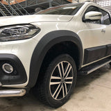 Mercedes X-Class 2017-2020 Wide Arch Kit & 35mm Wheel Spacers displayed on a parked white truck, showcasing stylish wheel arches and enhanced stability.