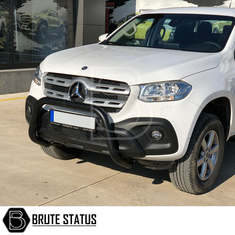 Ford Ranger 2012-2022 Bull Bar in matt black, enhancing truck's front with durable T304 stainless steel, shown on a white vehicle parked outside a building.