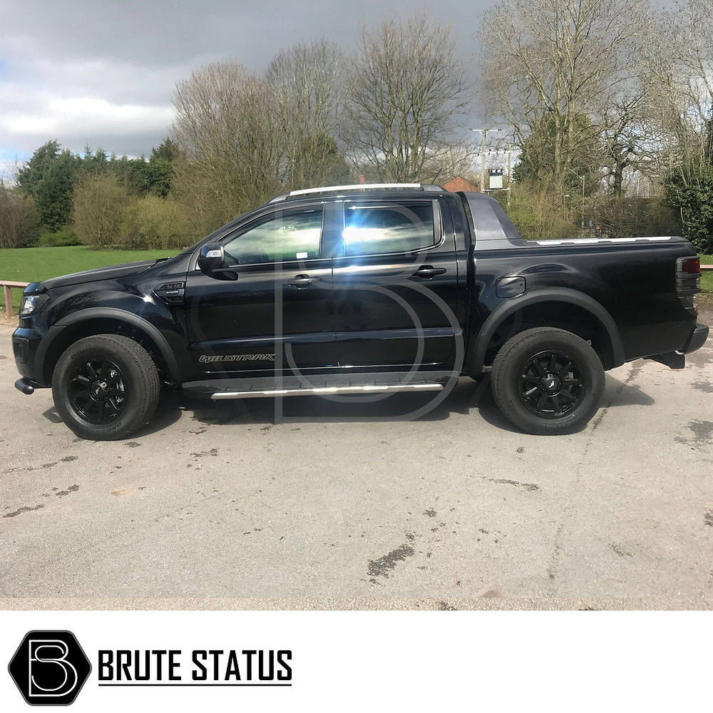 Ford Ranger 2015-2022 T7 T8 Wide Arch Kit & 35mm Wheel Spacers displayed on a parked black truck, highlighting its enhanced, muscular appearance.