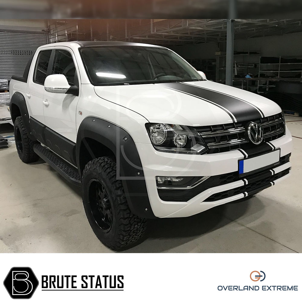 VW Amarok 2010-17 Wide Arch Kit (Overland Extreme) on a white truck, showcasing premium wheel arches with durable ABS plastic and riveted style.