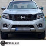 Nissan Navara 2015-2022 NP300 D23 Headlight Cover Guard Matte Black on a silver truck, enhancing its aggressive style and uniqueness.