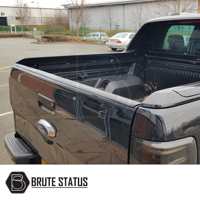 Ford Ranger 2012-2022 Tailgate Protector/Cover shown on a black truck, highlighting its smooth finish and wrap-around design for enhanced protection and easy installation.