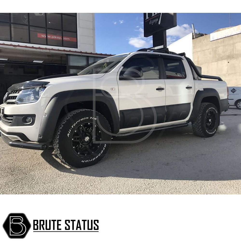 VW Amarok 2010-2016 Bonnet Guard Protector and Window Wind Deflectors shown on a white truck, highlighting durability and sleek design for enhanced vehicle customization.