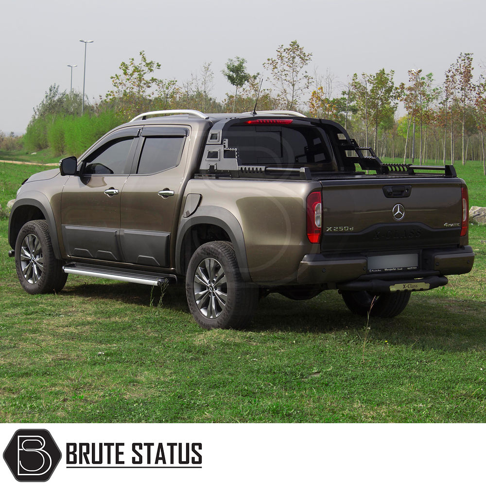 Mitsubishi L200 Series 5 2015-2019 S11 Combat Roll Bar, shown on a parked truck, features a durable, matte black finish and heavy-duty steel construction.