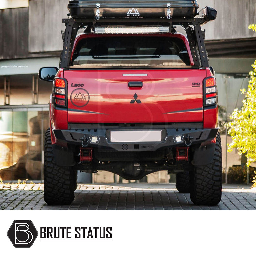 Fiat Fullback 2015-2019 Rear Bumper Matt Black, shown fitted on a red truck, featuring a luggage rack and designed for enhanced protection and style.