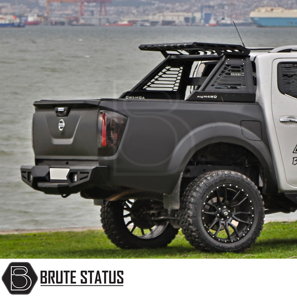 Mitsubishi L200 Series 6 2019-2021 M10 Roll Bar on parked truck, showcasing robust design and matte black finish, ideal for enhancing vehicle's aggressive appearance.