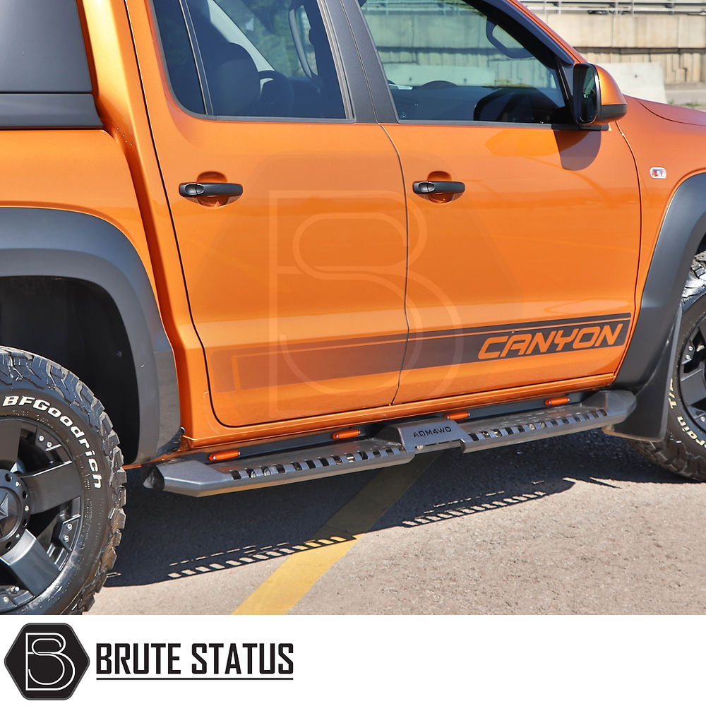 Nissan Navara NP300 2015-2022 Heavy Duty S32 Steel Side Steps With LEDs shown close-up on a truck, highlighting their robust, matt black finish.