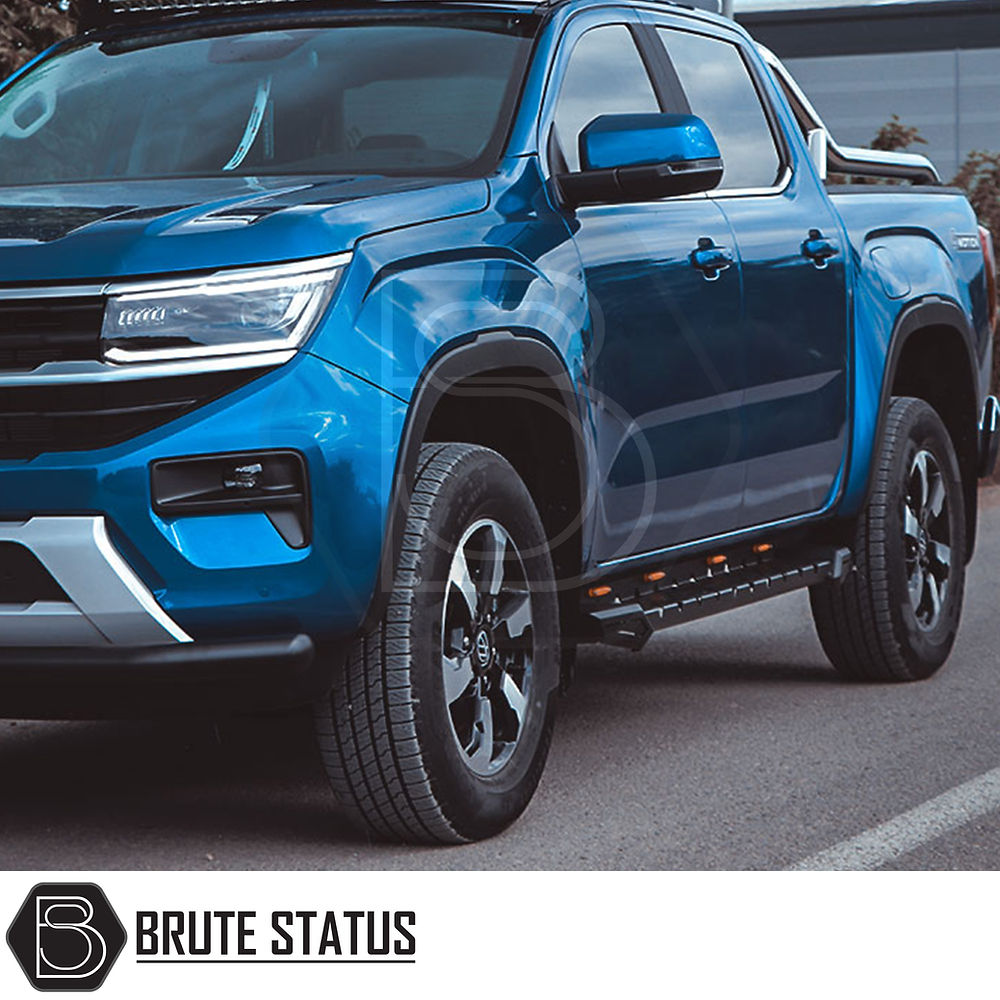 Volkswagen Amarok 2017-2022 Heavy Duty M30 Steel Side Steps, shown on a blue truck, offering durable, TÜV certified side protection with matt black finish.