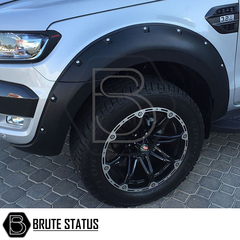 Ford Ranger 2016-19 Wide Arch Kit (Riveted Style) showcasing a close-up of robust tire and fender, highlighting durable ABS plastic design for enhanced truck aesthetics.