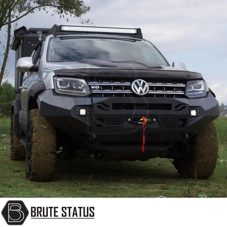 VW Amarok 2010-2016 Heavy Duty Winch Front Bumper with matte black finish, LED lights, and space for winch installation. Ideal for customization and towing.