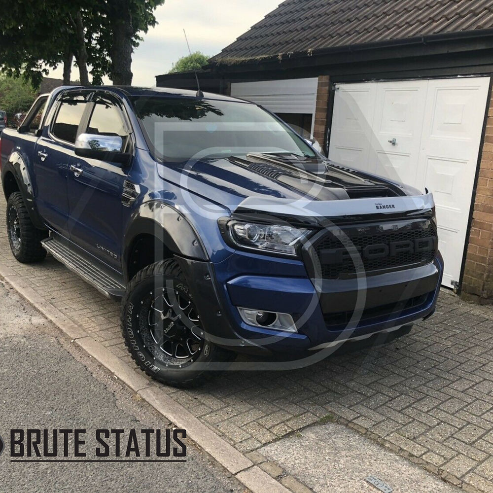 Ford Ranger 2015-2022 Facelift Raptor Style Bonnet Scoop Vent in matte black finish, displayed on a parked truck, highlighting its smooth design and impact-resistant material.