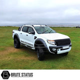 Ford Ranger 2012-2019 2 Lift Kit, showcasing a white truck parked on grass, ideal for enhancing your truck's stature.