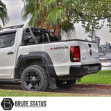 Volkswagen Amarok 2023+ Roll Bar on a parked white truck, showcasing its heavy-duty, matte black steel construction. Ideal for enhancing the vehicle's aggressive look.