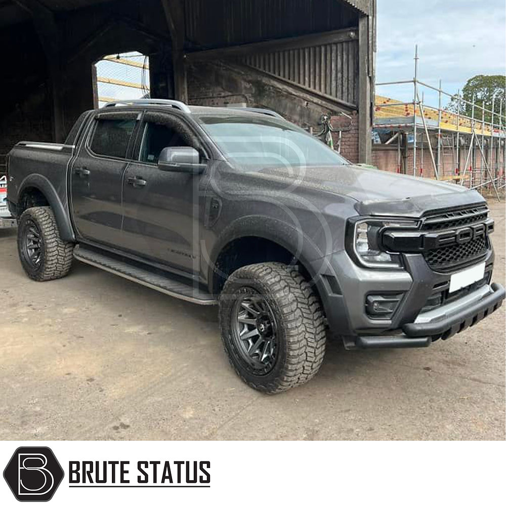 Ford Ranger T9 2023+ Wide Arch Kit (Raptor Style) displayed on a parked grey truck, showcasing its wide arches and sleek design. Suitable for double cab models.