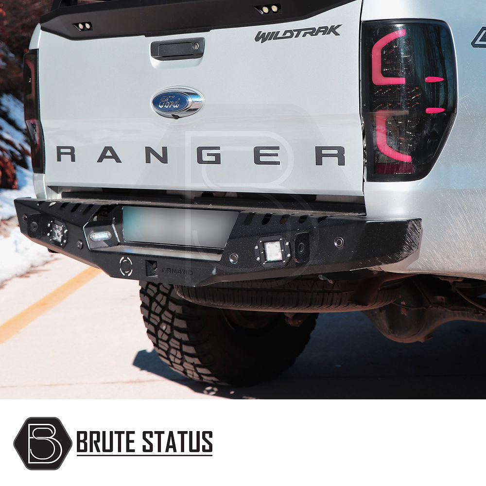 Ford Ranger 2012-2022 rear bumper in matt black, showcasing robust design, parking sensor holes, and integrated lights, enhancing style and protection.