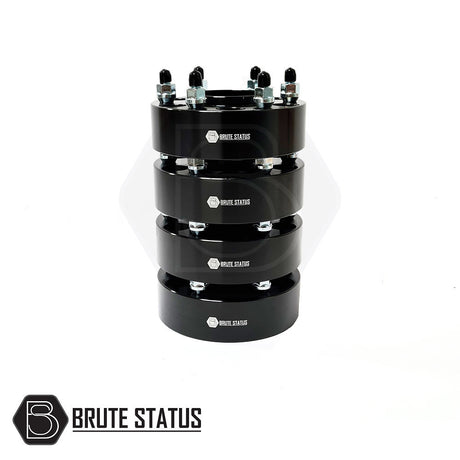 Nissan Navara 2005-2022 50mm Hubcentric Wheel Spacers, set of 4, stacked black metal cylinders with pre-installed studs, enhancing vehicle stability and wheel space.