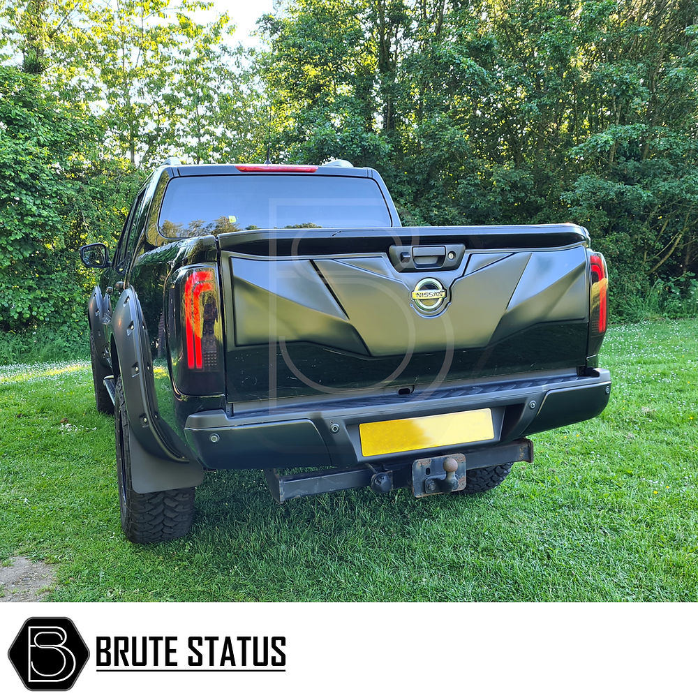 Nissan Navara NP300 2015-2022 LED Tail Lights installed on a black truck, showcasing sleek aftermarket design and easy fitment for enhanced vehicle customization.