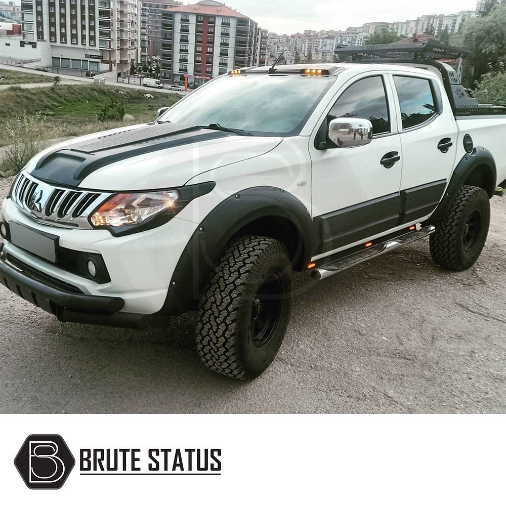 Fiat Fullback 2015-2019 Bonnet Scoop on a white truck, showcasing its aggressive design and smooth black finish for enhanced individuality.