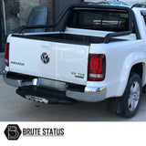 VW Amarok 2010+ Roll Bar Matt Black on a white truck, featuring a durable, stylish black powder-coated finish designed for lasting performance and aesthetics.