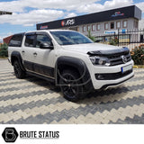 VW Amarok 2010-2022 Window Deflector Sun Shade on a parked white truck, showcasing its durable, scratch-resistant design, perfect for enhancing style and functionality.