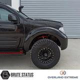 Nissan Navara D40 2005-2010 Overland Extreme Wide Arch Kit showcased on a black truck, emphasizing premium wheel arches designed for enhanced vehicle appearance.